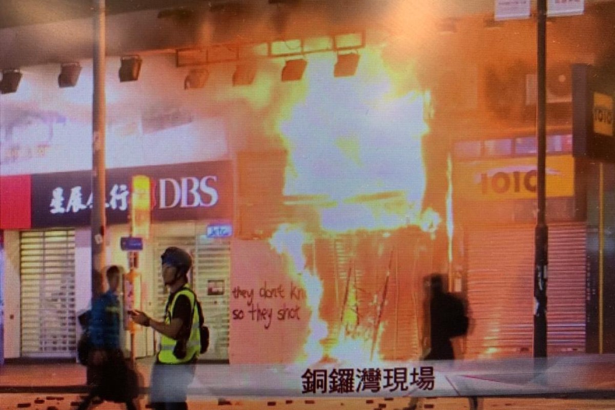 As it happened: Causeway Bay shop engulfed in flames with flats above, as protests erupt across Hong Kong and police under attack draw guns