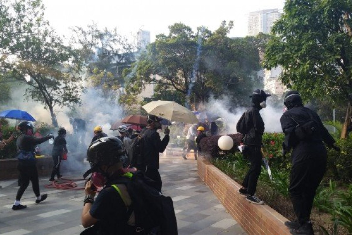 Police fire tear gas at the Polytechnic University Chatham Road South entrance. Photo: SCMP