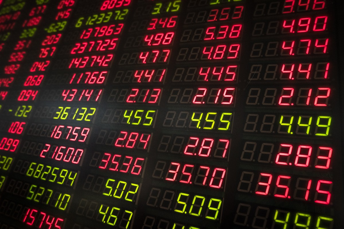 An electronic board displays stock prices at a securities brokerage in Beijing. Photo: EPA-EFE