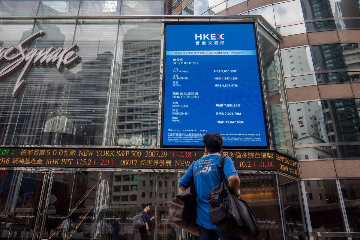 An electronic ticker board displays stock prices outside the Exchange Square complex, which houses the Hong Kong stock exchange. Photo: Bloomberg