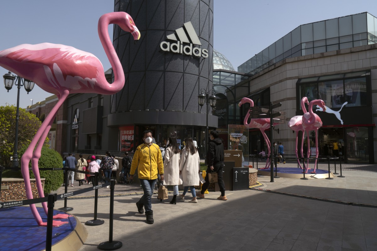 A pedestrian walks past an Adidas AG store in Beijing on April 4, 2020. Photo: Bloomberg
