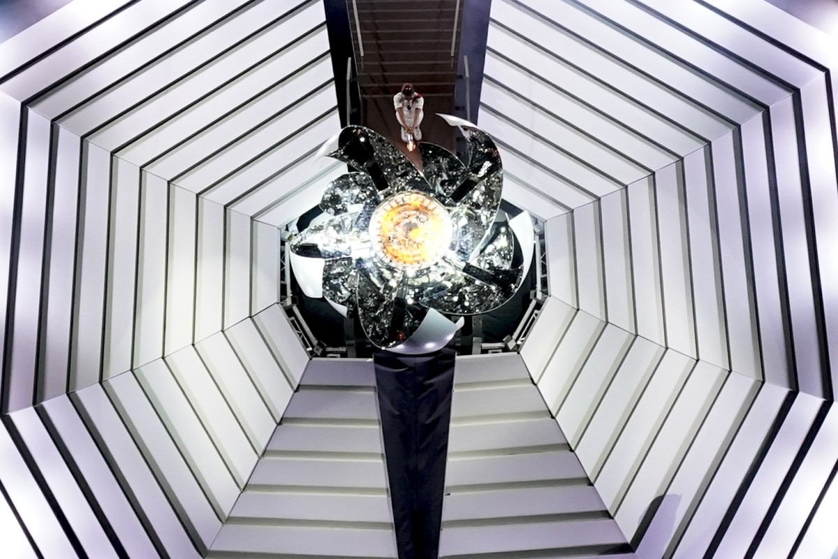 Naomi Osaka lights the Olympic Cauldron during the opening ceremony in Tokyo. Photo: AP
