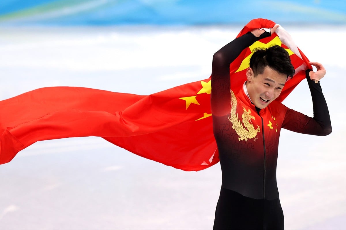 Short-track speed skater Ren Ziwei of Team China celebrates winning gold in the men’s 1,000m Final A at the Beijing 2022 Winter Olympic Games. Photo: Catherine Ivill/Getty Images