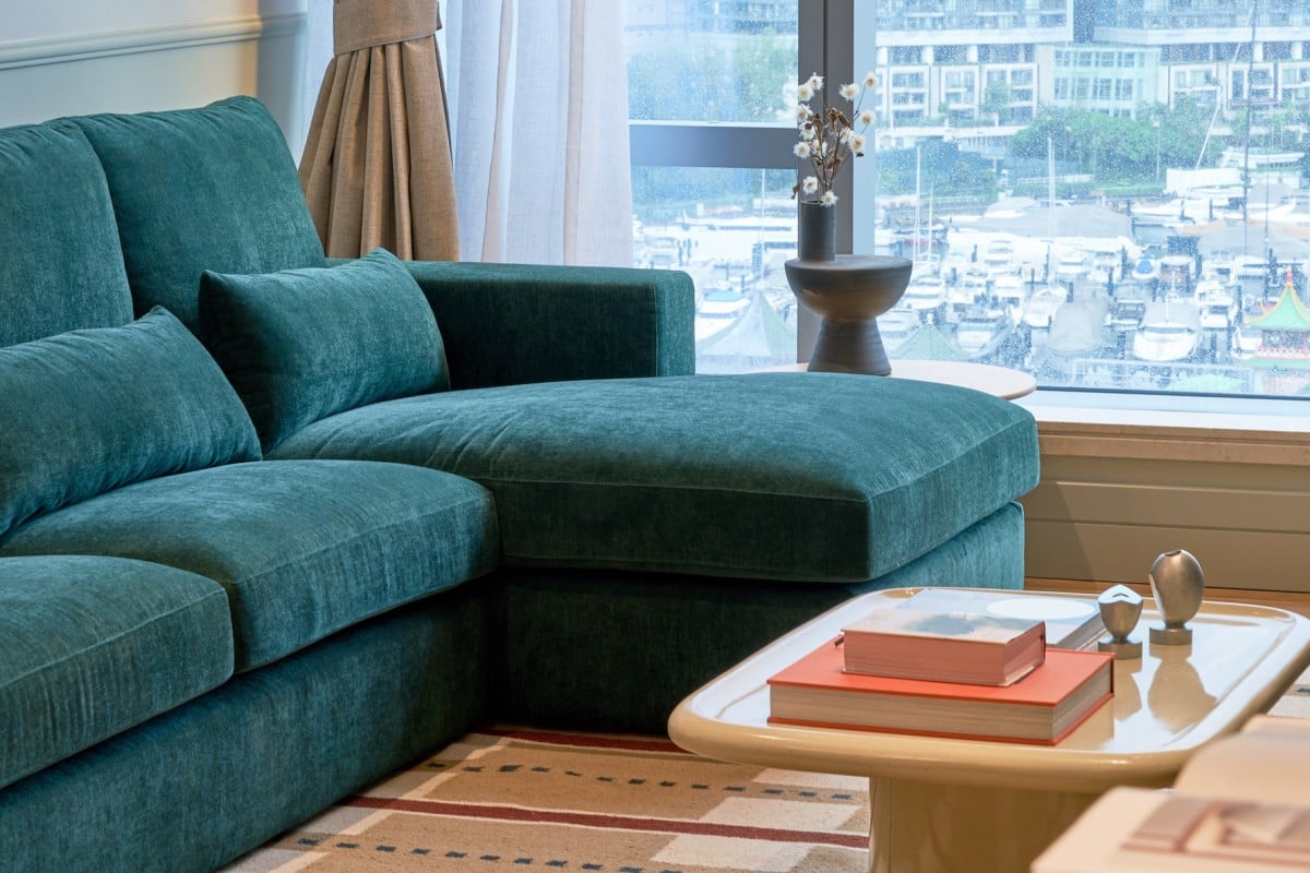 A sofa upholstered in Hong Kong tram green, or Generation Z green as designer JJ Acuna calls it, is a feature of an Ap Lei Chau flat full of nostalgic touches. Photo: Xu Liang Leon