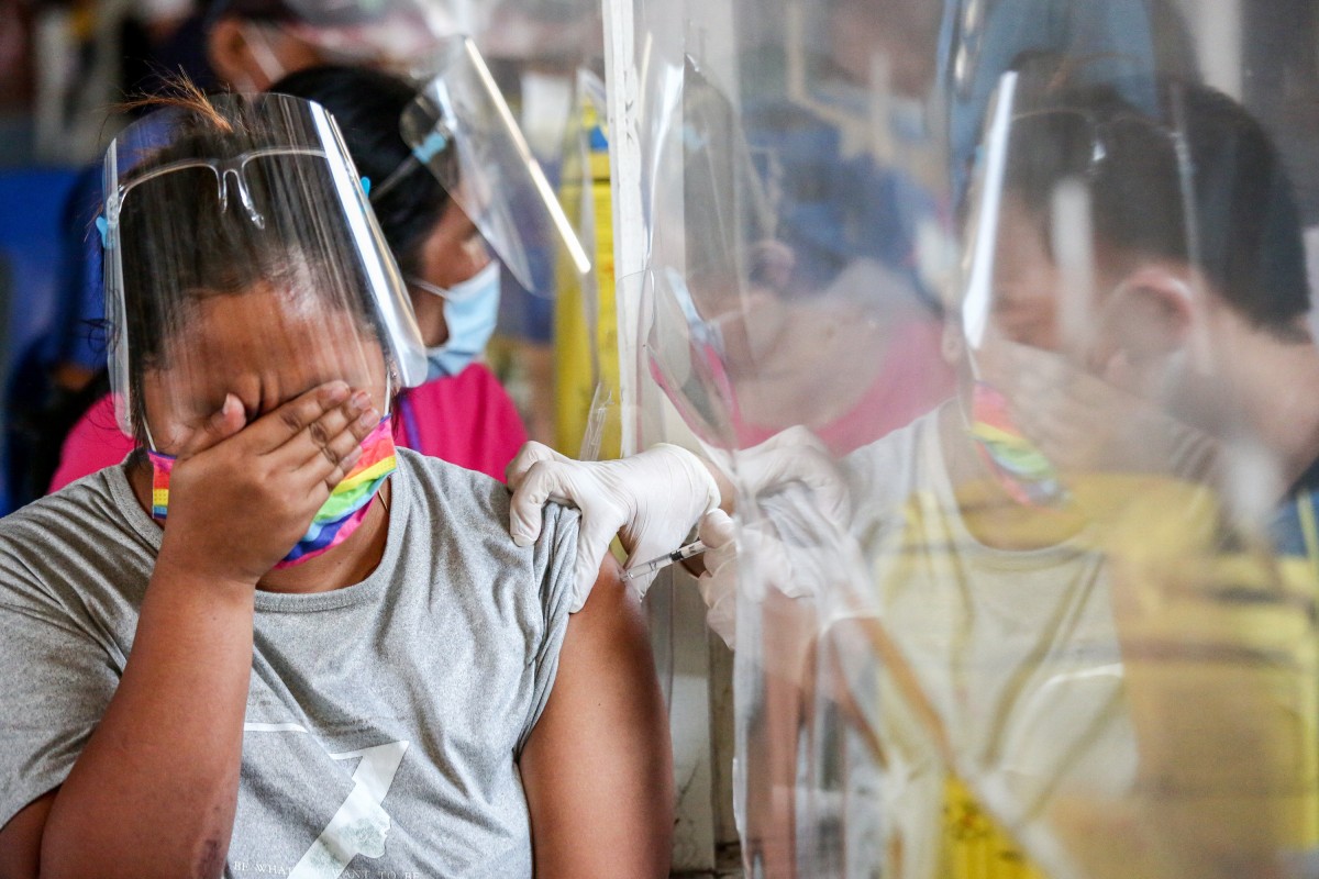 A woman receives the AstraZeneca coronavirus vaccine  in Quezon City, the Philippines. Photo: DPA