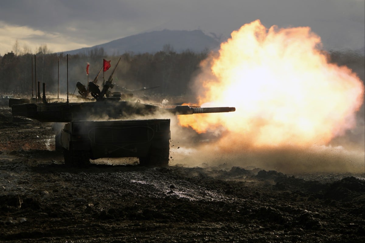 Japanese Ground-Self Defence Force Type 90 tank fires its gun at a target during a military drill in Eniwa, Hokkaido. Photo: AP