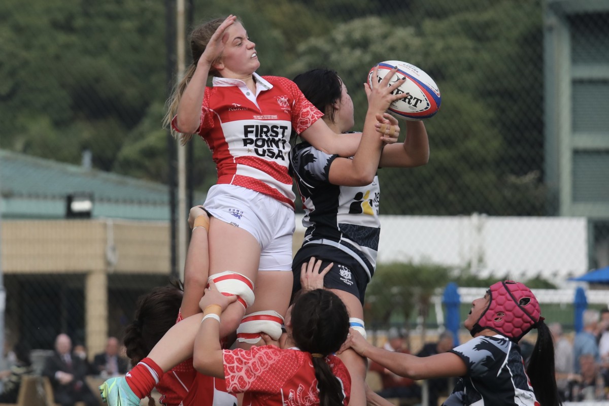 Hong Kong Clubs Select player Carter Bedford (in red) contests a lineout during her side’s game against ESF at Happy Valley. Photo: Xiaomei Chen