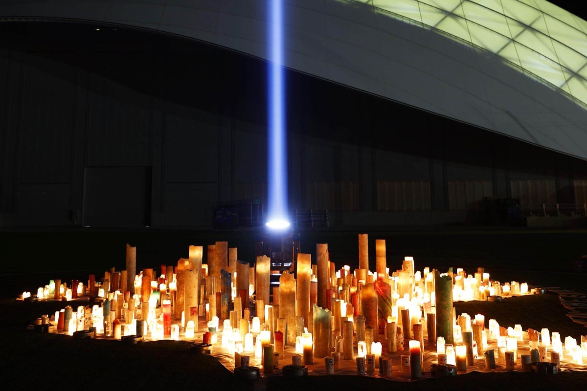 Candles are lit at the J-Village soccer training centre in Fukushima prefecture on the 10th anniversary of the nuclear disaster. Photo: Kyodo