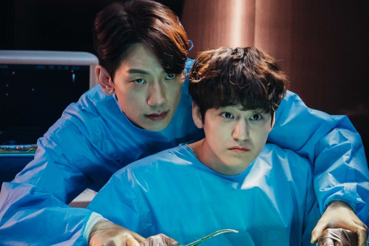 Rain (left) and Kim Beom in a still from Ghost Doctor.