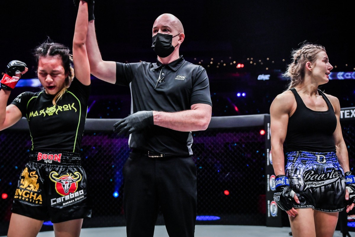 Supergirl’s arm is raised after winning a controversial split decision against Ekaterina Vandaryeva (right) at ONE: Heavy Hitters. Photos: David Ash/ONE Championship