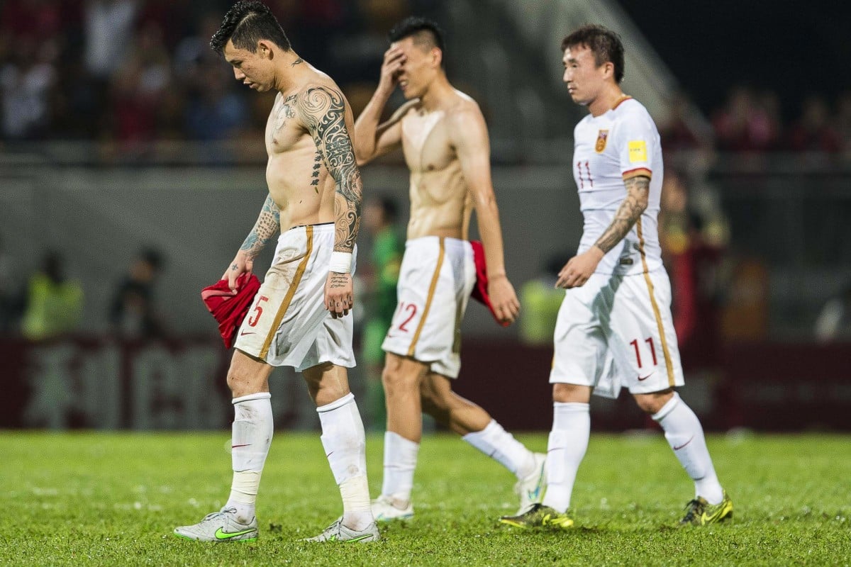 Chinese soccer players with tattoos, such as Zhang Linpeng (above left) and Wang Yongpo (above right), have been told to cover them up and banned from getting new tattoos. Negative views of tattoos have a long history in China. Photo: EPA