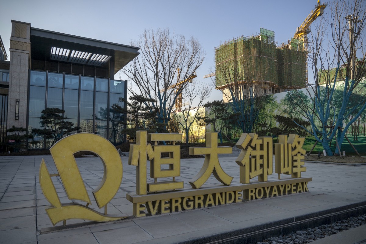 Signage outside a sales office of China Evergrande Group in Beijing. Photo: Bloomberg