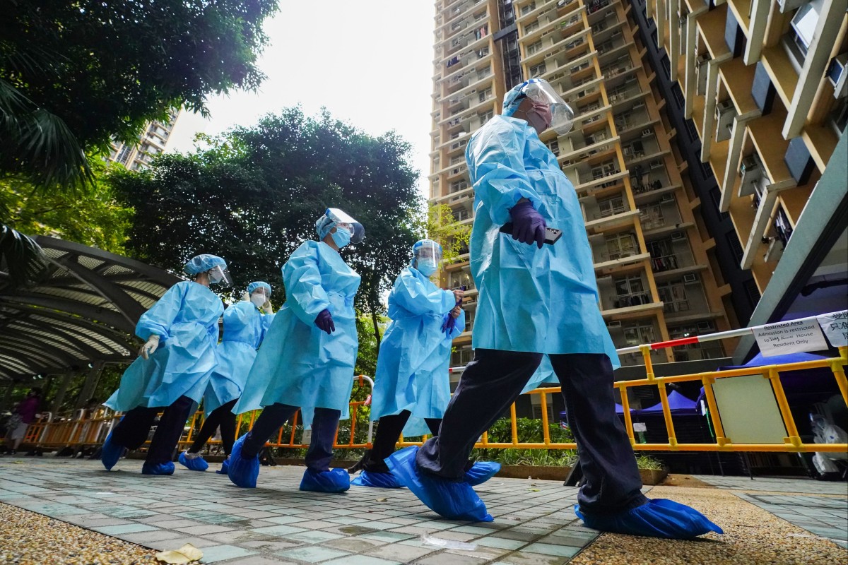 Health workers in protective gear at Kwai Chung Estate, the centre of a superspreading event. Photo: Felix Wong