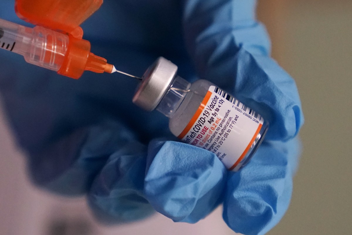 A pharmacist prepares a dose of the Pfizer Covid-19 vaccine in Lawrence, Massachusetts, in December. Photo: AP