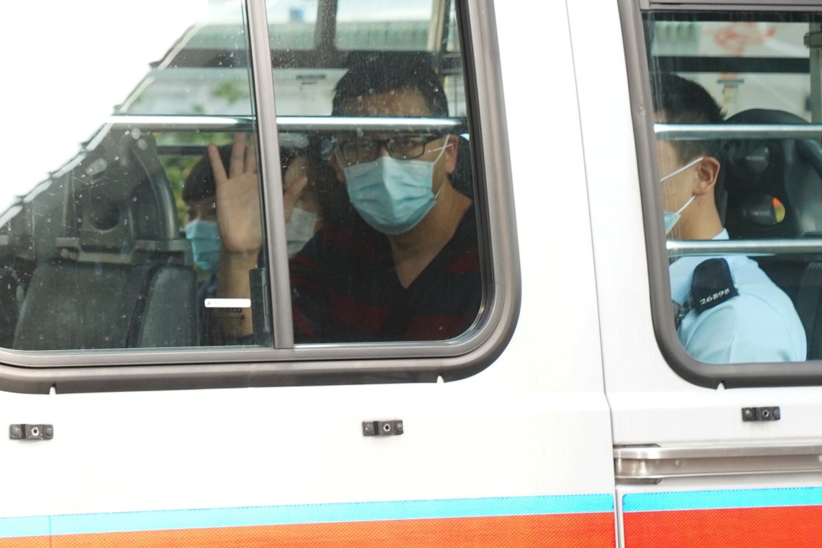 Former lawmaker Lam Cheuk-ting arrives at West Kowloon Magistrates’ Courts in a police vehicle on March 1, 2021. Photo: Reuters