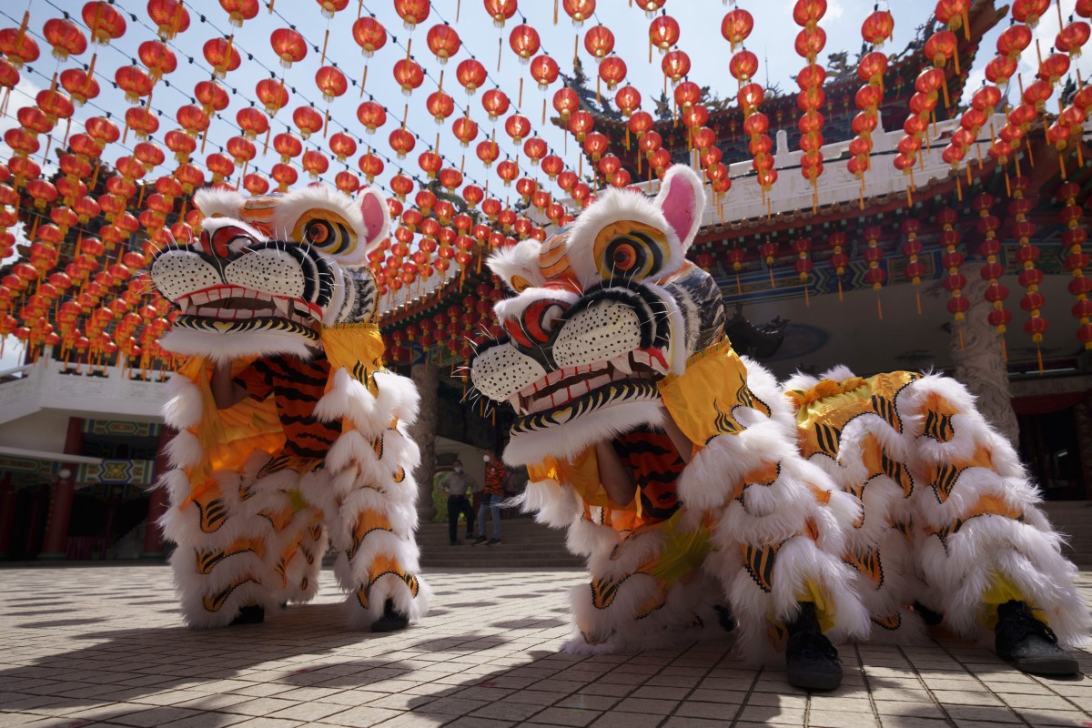 Hainan tiger dance is performed ahead of the Lunar New Year in Kuala Lumpur, Malaysia. Photo: AP