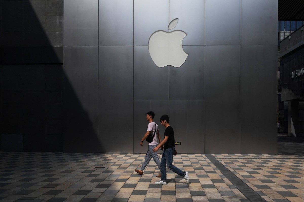 People walk past an Apple store in Beijing in August 2017. Photo: AFP