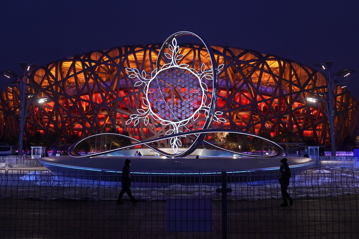 The Olympic flame burning in the centre of the snowflake-shaped cauldron is on display near the National Stadium at the 2022 Winter Olympics in Beijing. Photo: AP