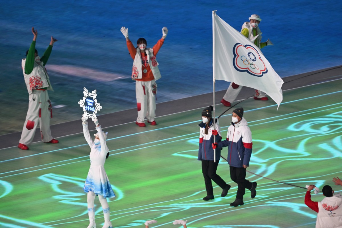 Huang Yu-ting (left) and Ho Ping-ju carry the Olympic flag representing Taiwan at the Beijing Winter Games opening ceremony on February 4. Photo: DPA