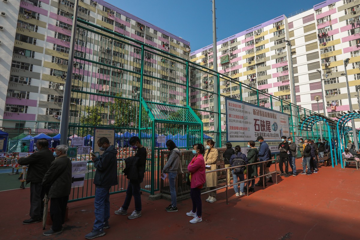 Residents wait in line for BioNTech inoculation at a mobile vaccination station in Shek Kip Mei on Sunday. Photo: Yik Yeung Man