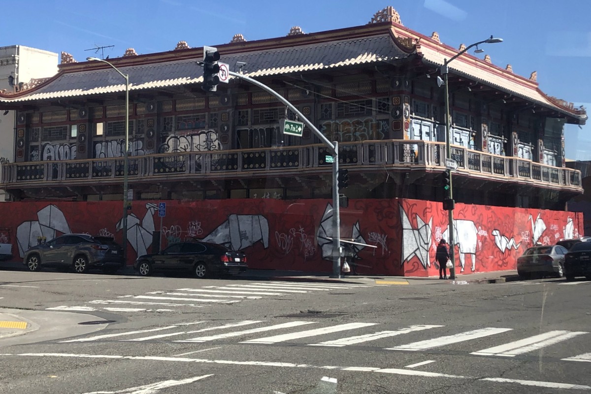 A mural of Chinese Zodiac signs are painted onto the wood used to board up a historic building in Oakland’s Chinatown. Photo: Ralph Jennings
