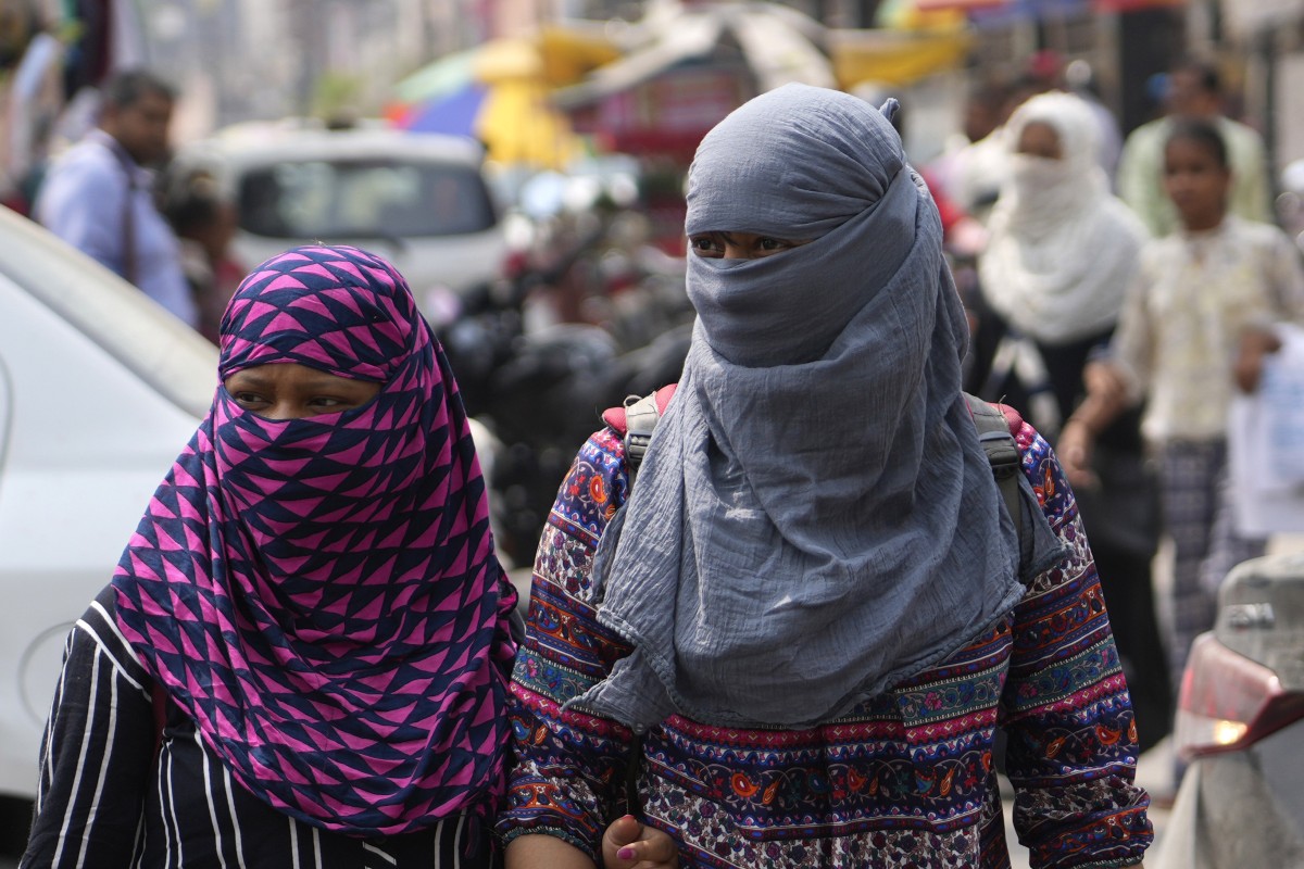 Women wear scarves around their heads amid an early heat wave in Uttar Pradesh on Wednesday. Women in India have long faced sexual harassment in public. Photo: AP