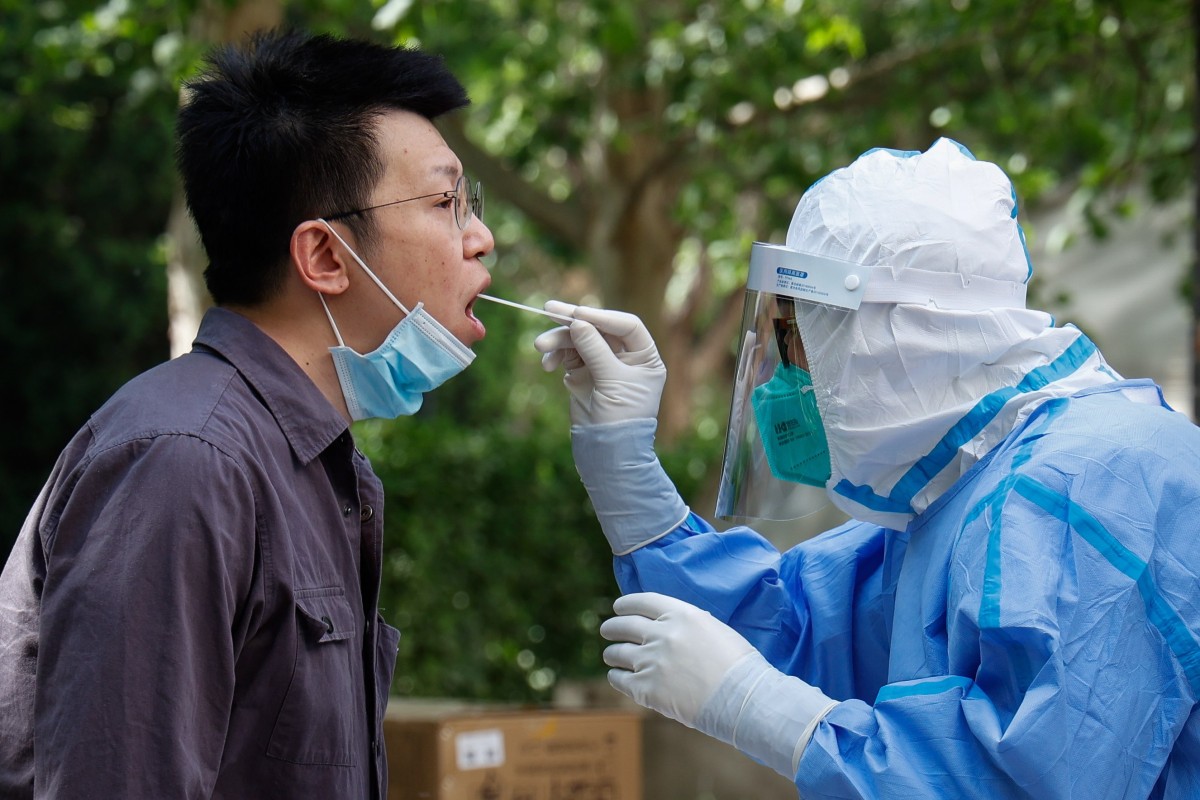 A man undergoes a Covid-19 test in Beijing on Wednesday. Photo: EPA-EFE