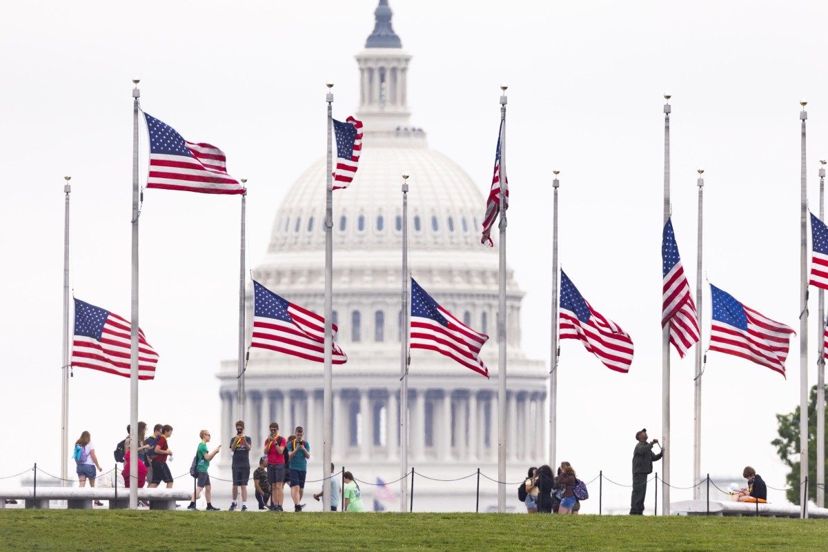 US flags are lowered to half-staff on the National Mall in Washington on Thursday to mark 1 million US Covid-19 deaths. Photo: EPA-EFE
