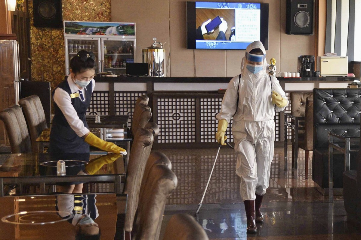 Workers disinfect a restaurant in Pyongyang, North Korea. File photo: Kyodo