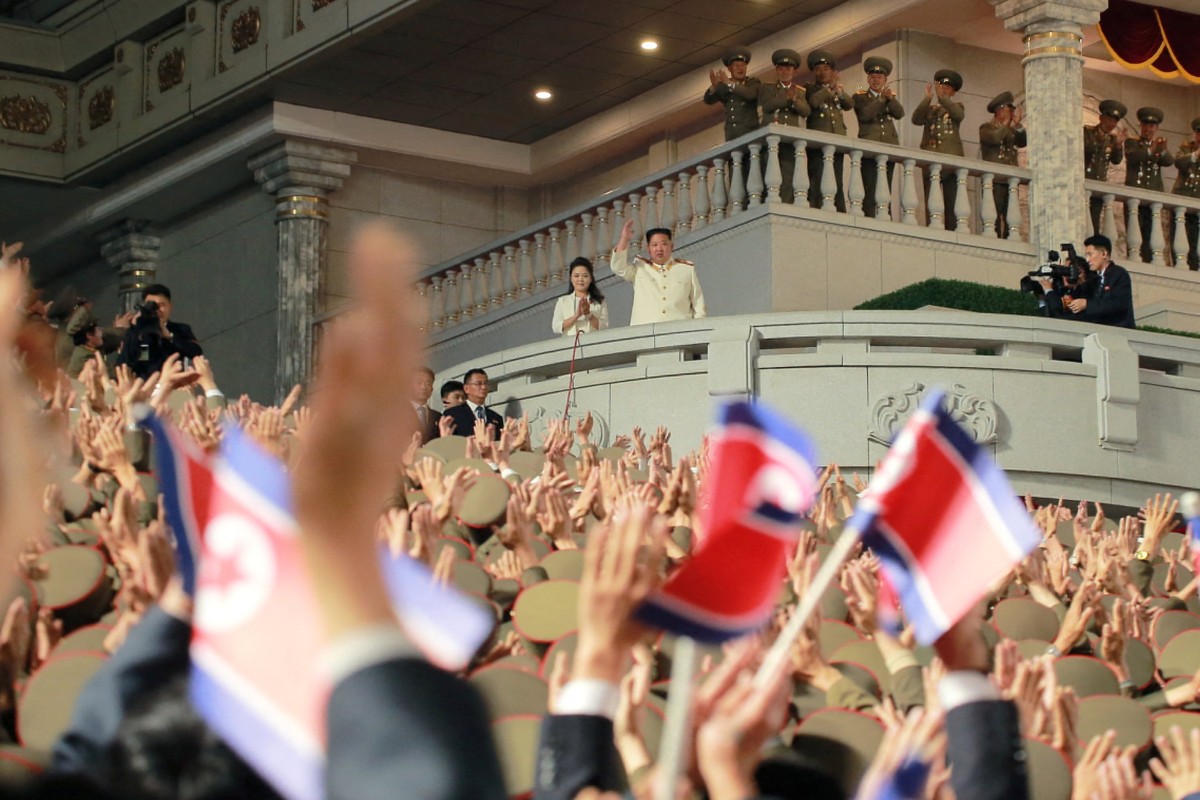North Korean leader Kim Jong-un and his wife wave to the crowds at the April 25 military parade. Photo: Korean Central News Agency via Reuters