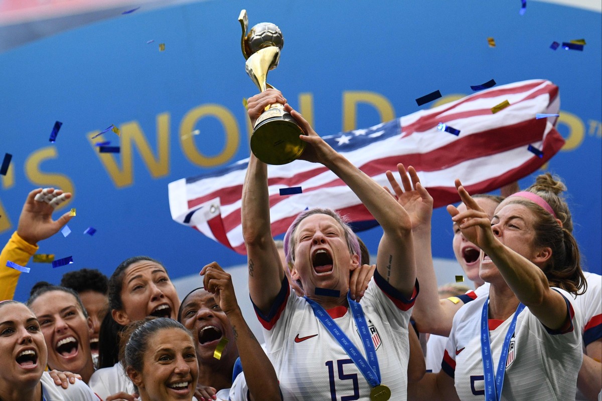 USA’s players including forward Megan Rapinoe (centre) celebrate with the trophy after the France 2019 Women’s World Cup final. Photo: AFP
