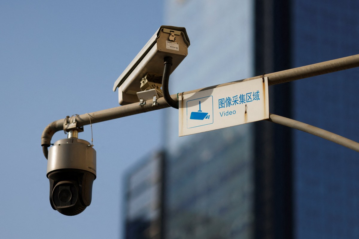 Video surveillance cameras overlooking a street in Beijing, China. If people think they are being spied on wherever they go, even if that is not so, they will be cowed, the theory goes. Photo: Reuters