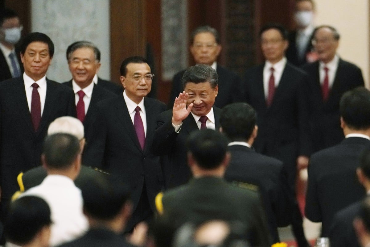 President Xi Jinping waves as he walks ahead of other members of the Politburo Standing Committee during a dinner reception at the Great Hall of the People in Beijing on September 30, the eve of the National Day holiday. Photo: AP