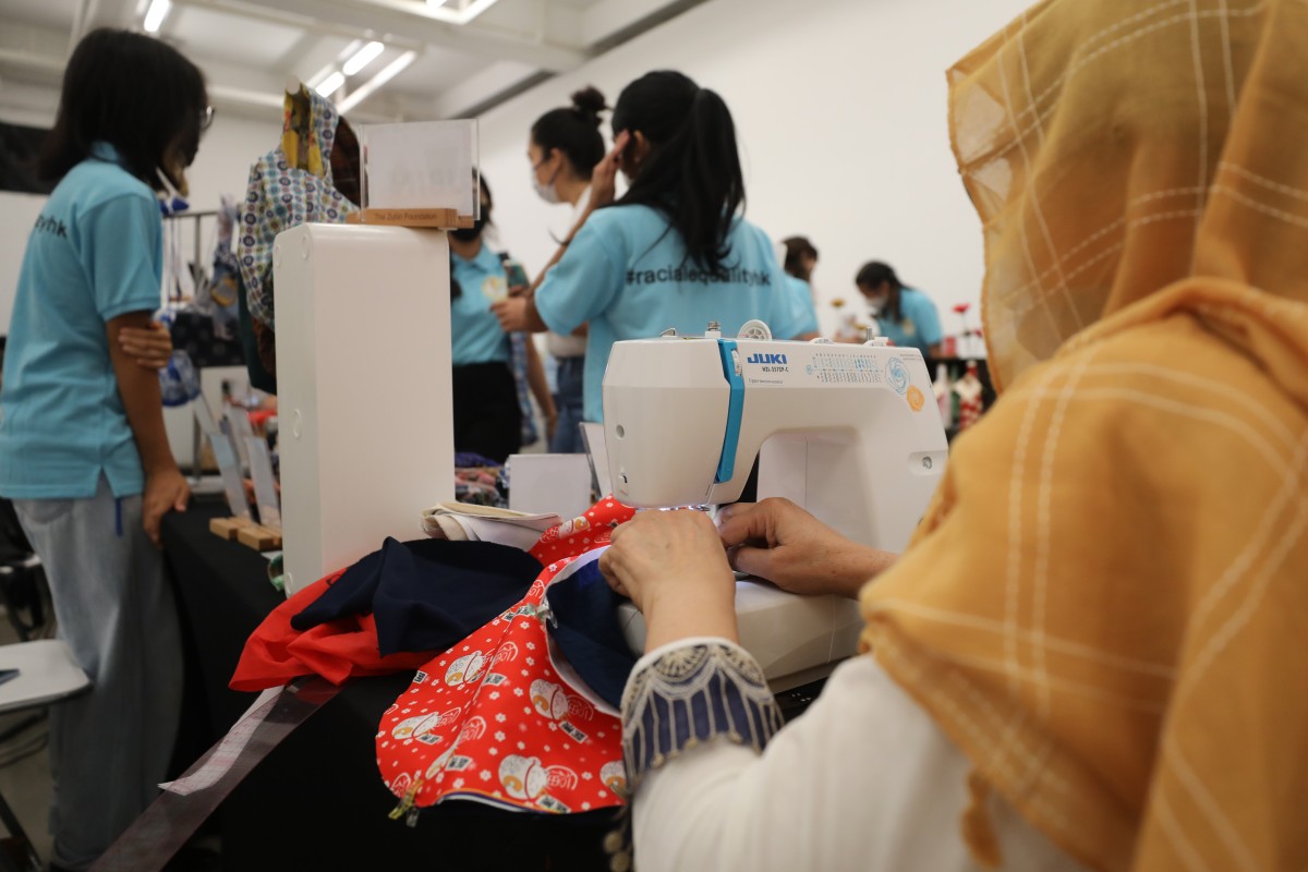 Arshad sews at the Women’s Empowerment Christmas Bazaar held in Tai Kwun, Central, on Saturday. Photo: Xiaomei Chen