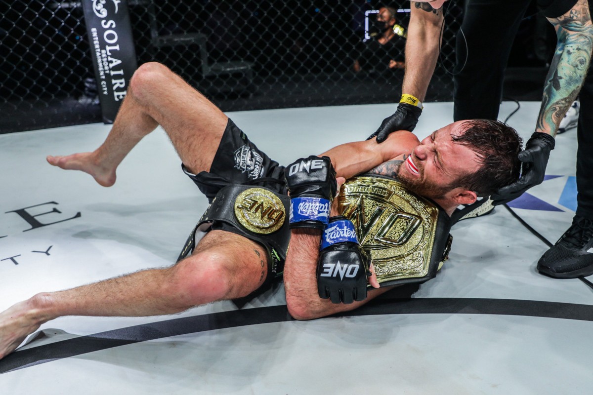 Jarred Brooks celebrates after winning the strawweight title. Photo: ONE Championship