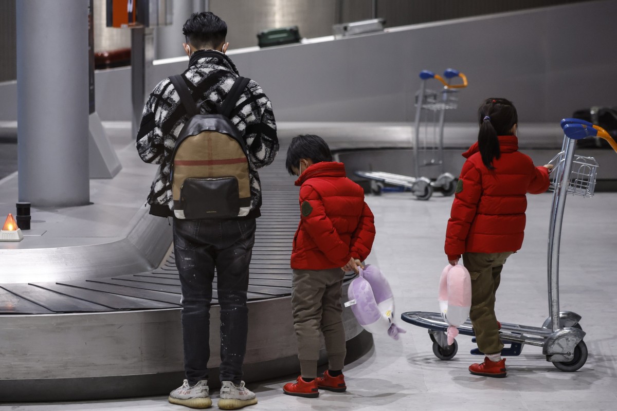 People travelling from China wait for their baggage at an airport in France. Photo: EPA-EFE