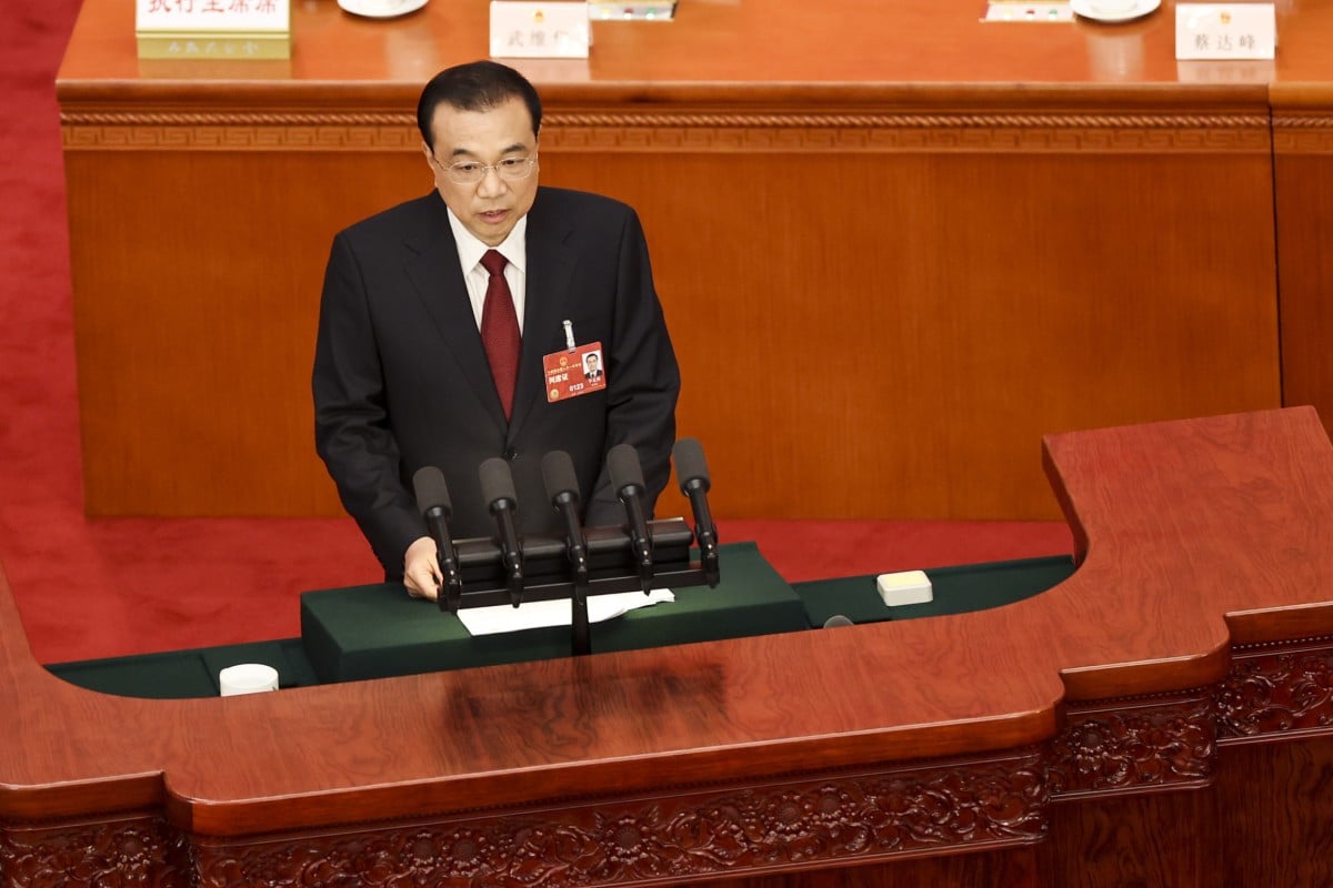 Chinese Premier Li Keqiang (bottom) delivers the annual government work report at the Great Hall of People on Sunday. Photo: Getty Images