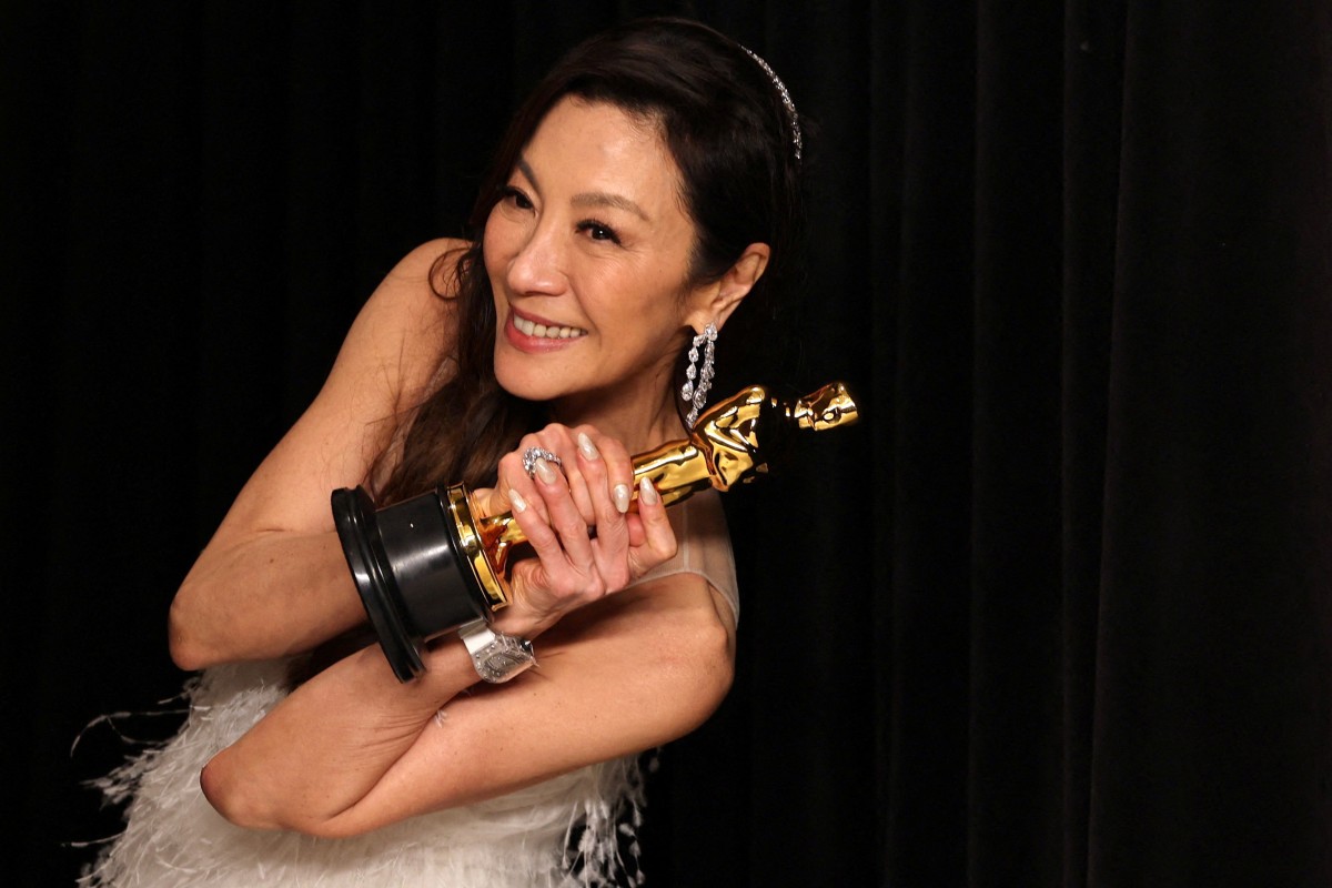 Best actress Michelle Yeoh poses with her Oscar backstage at the Academy Awards in Hollywood, Los Angeles, after becoming the first Asian to win in the category in the 95 years of the Academy Awards. Photo: Reuters
