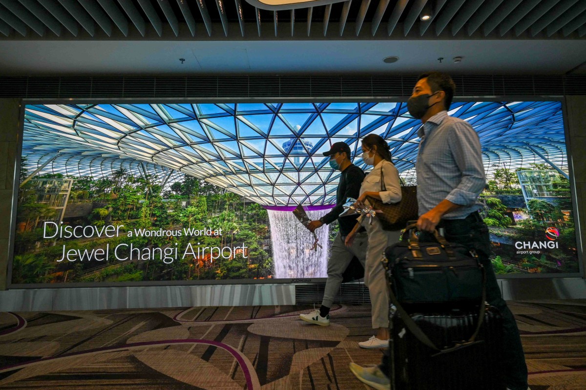 Passengers at Changi International Airport. Singapore has reported a spike in Covid-19 infections. Photo: AFP