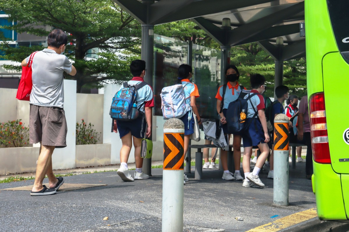 Students in Singapore board a public bus to go home after school. Photo: Shutterstock
