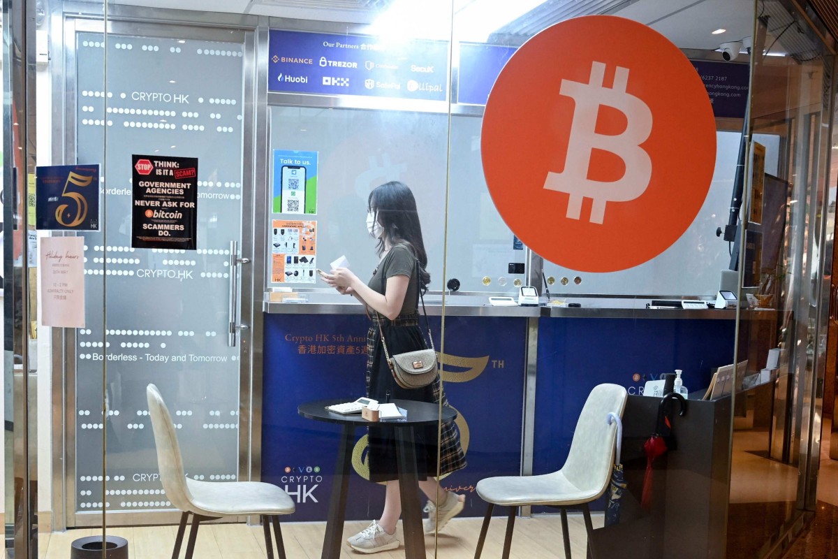 A woman in a cryptocurrency exchange office in Hong Kong. Photo: AFP