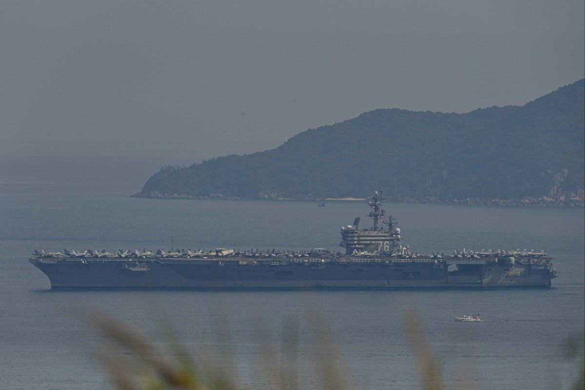 The USS Ronald Reagan, a US Navy Nimitz-class nuclear-powered aircraft carrier, pulls into port in Da Nang on Sunday. Photo: AFP