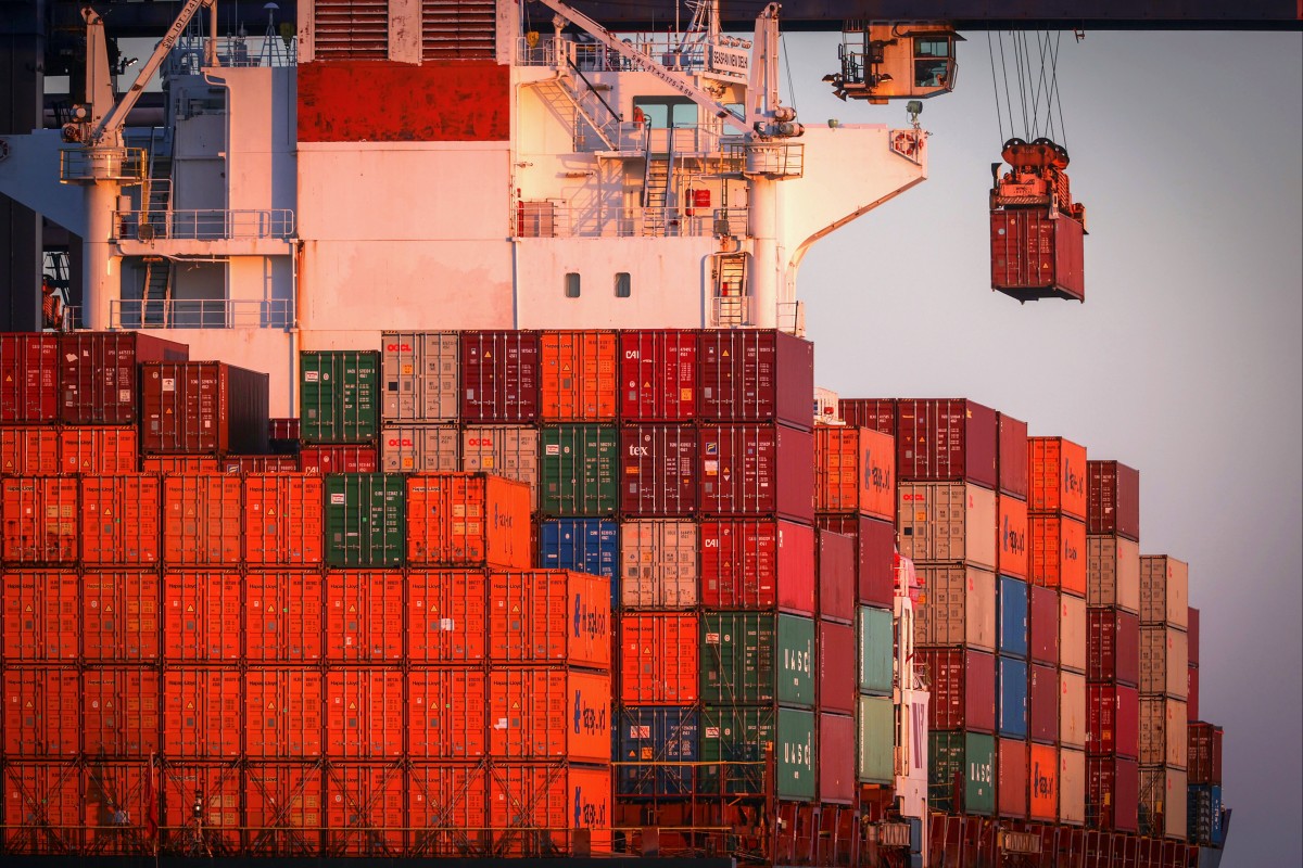 A gantry crane moves a shipping container at Port Botany in Sydney, New South Wales, Australia. Photo: Bloomberg