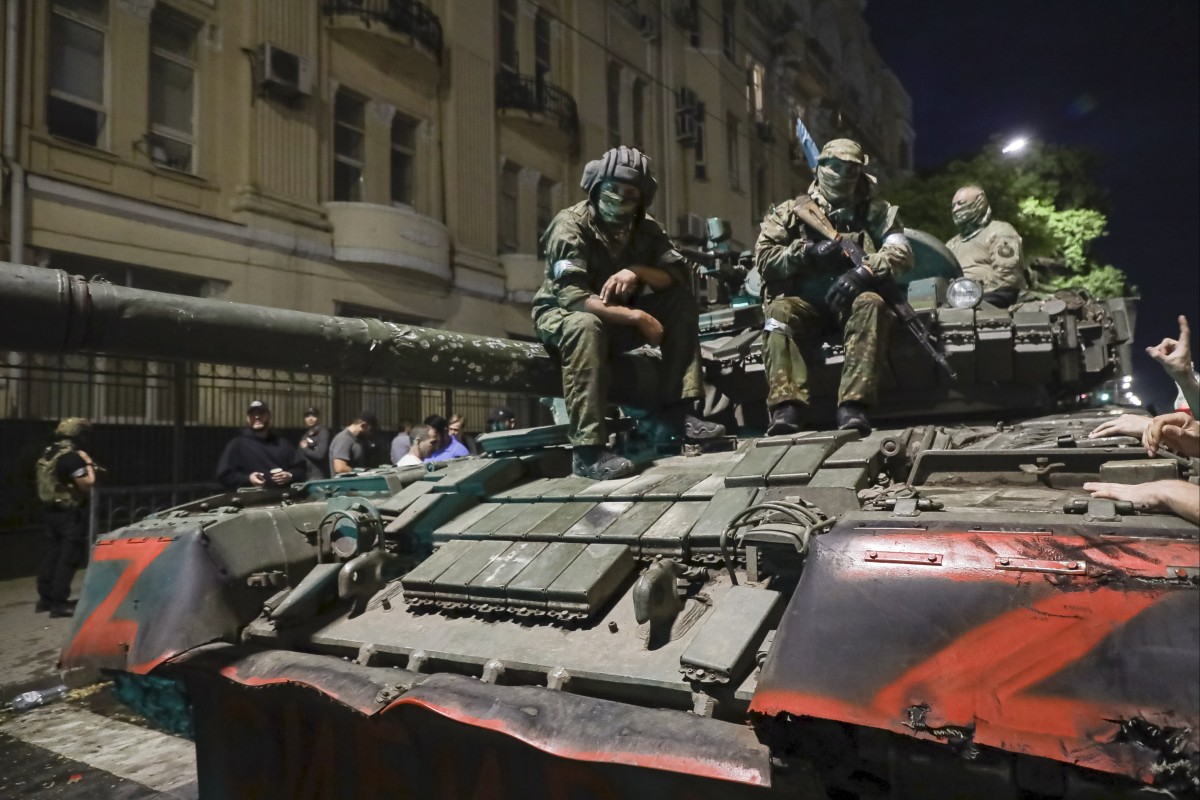 Members of the Wagner Group military company sit atop a tank on a street in Rostov-on-Don, Russia, on Saturday. Photo: AP