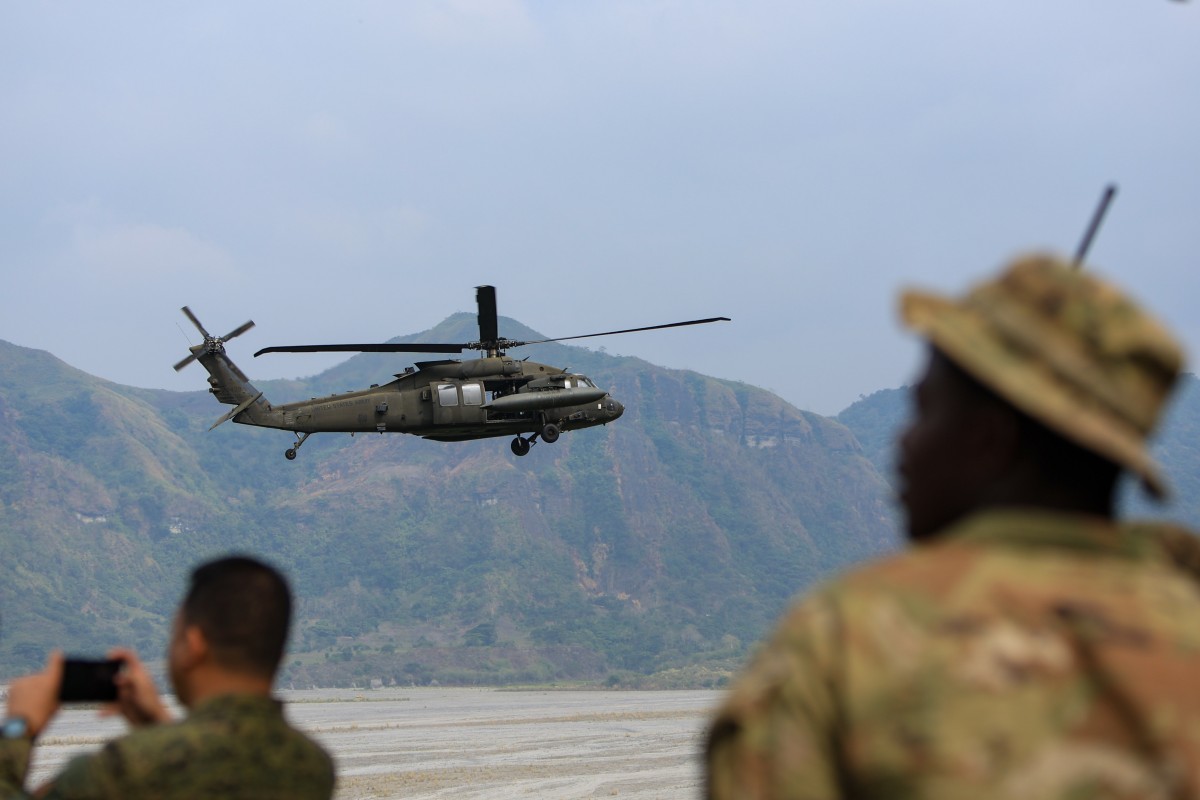 US and Filipino soldiers stand guard as a Black Hawk helicopter manoeuvres during a joint military drill. Photo: ZUMA Press Wire/dpa
