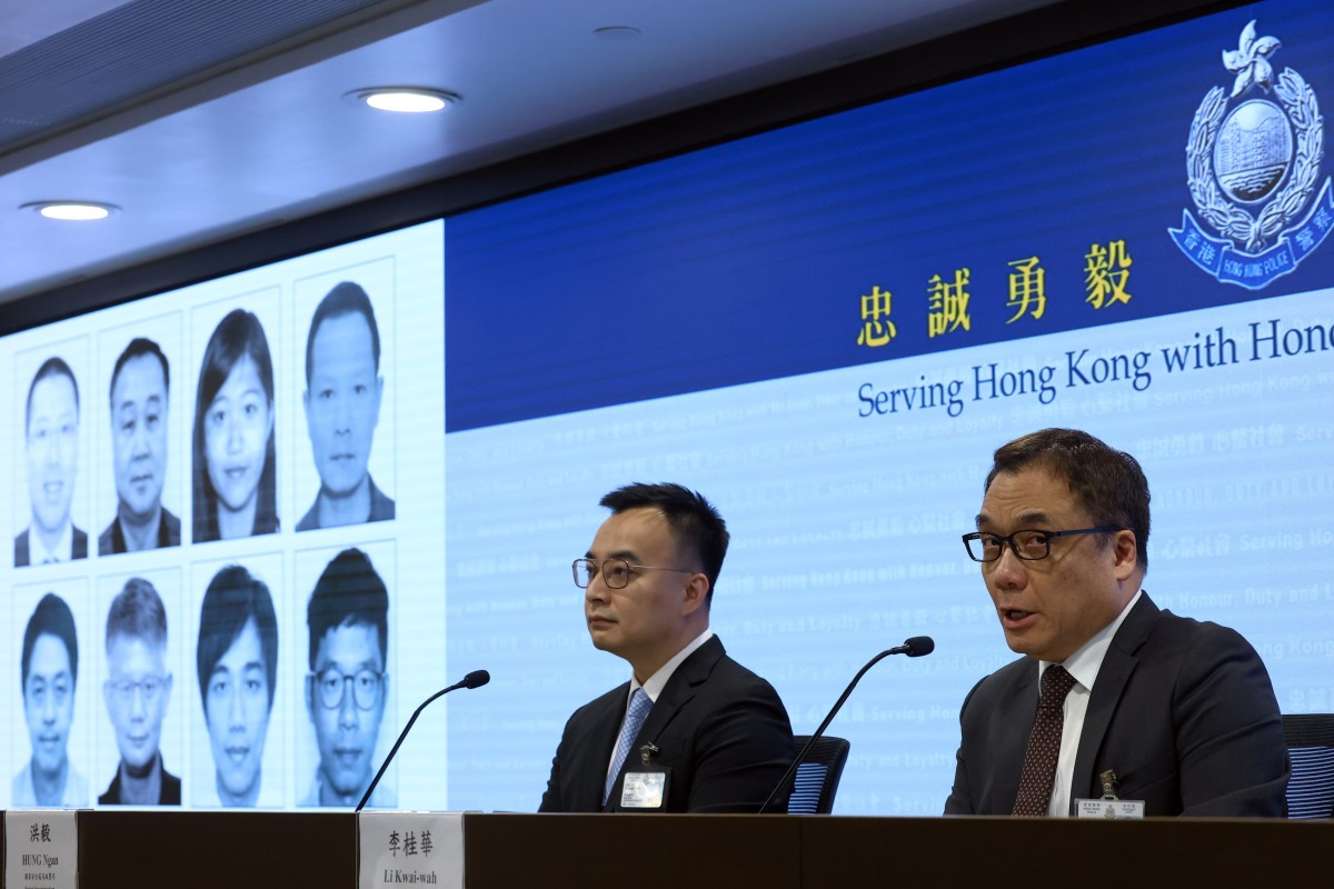 Police display the faces of eight suspects wanted under the national security law. Photo: Dickson Lee