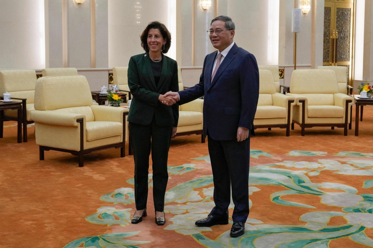 China’s Premier Li Qiang with US Commerce Secretary Gina Raimondo. Photo: AFP