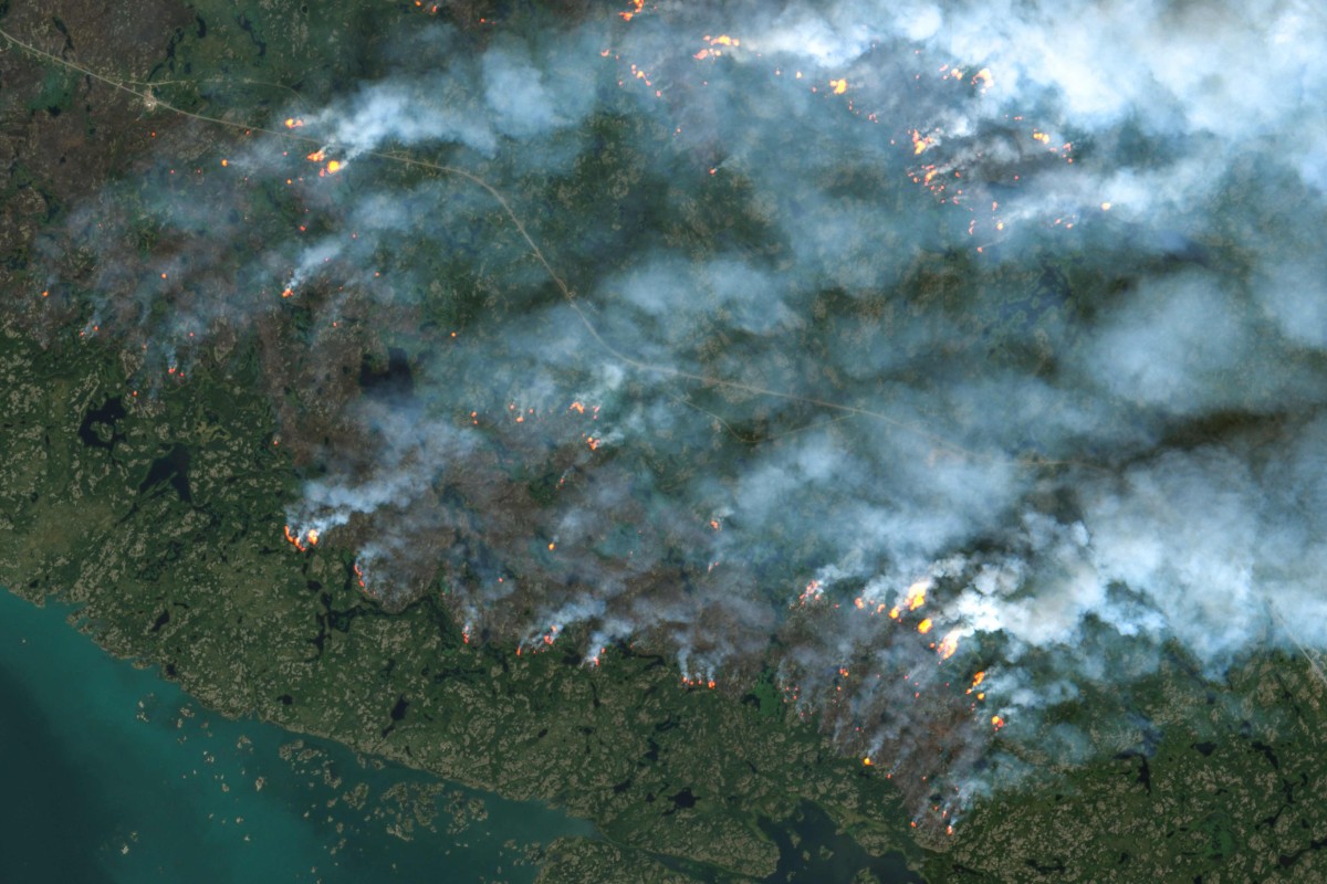 This satellite image from the European Space Agency’s Copernicus Sentinel-2 satellite taken on August 16 shows fires burning in Yellowknife, Northwest Territories, Canada. Satellites are essential to monitoring and measuring the effects of climate change. Photo: AFP/European Space Agency