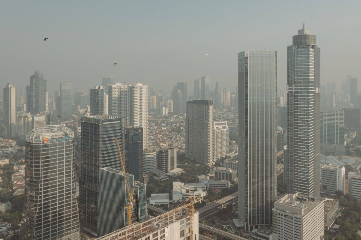 Buildings seen shrouded in smog in Jakarta last month. Indonesia’s capital is one of the fastest-growing hubs in the Asia-Pacific for energy hungry data centres. Photo: Bloomberg
