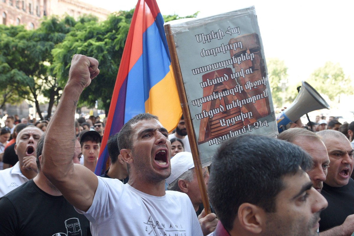 People take part in an anti-government rally in downtown Yerevan in Armenia on Friday, following Azerbaijani military operations against Armenian separatist forces in Nagorno-Karabakh. Photo: AFP